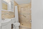 Newly renovated bathroom with a beautiful walk-in shower grab rail.